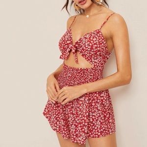 Red romper with small white flowers tie in front